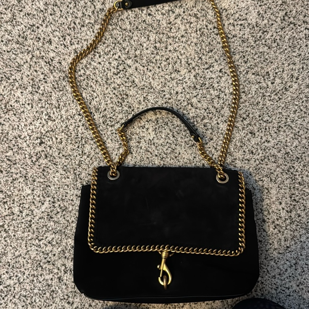 Black suede and gold over the shoulder bag